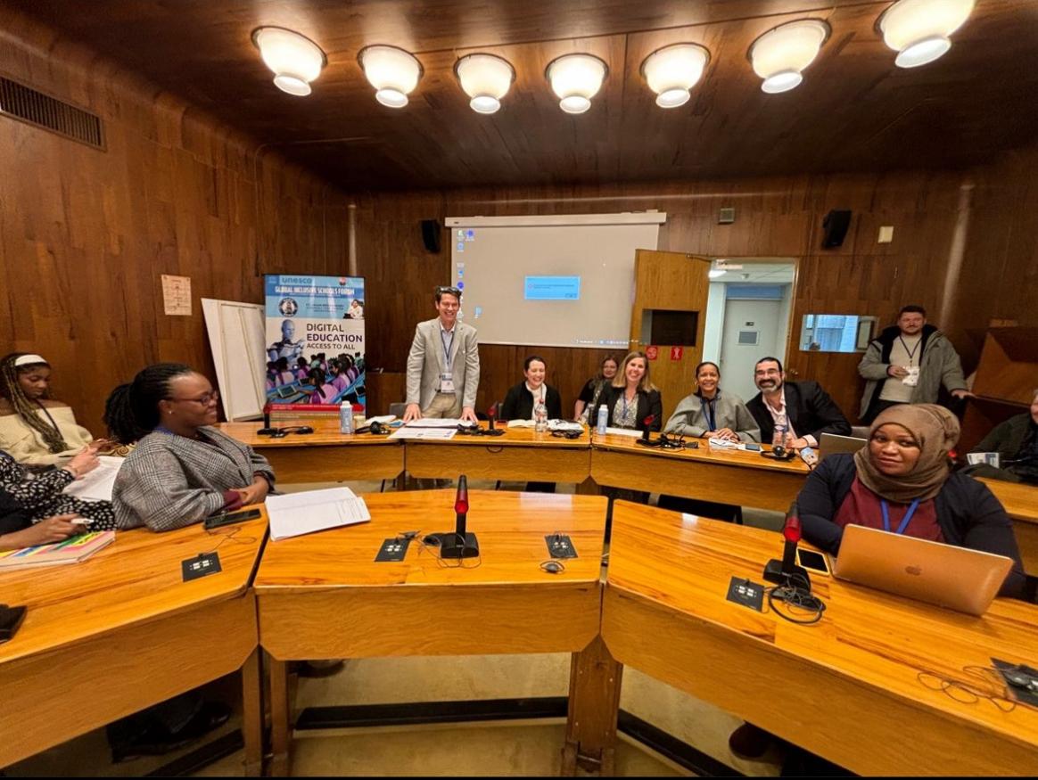 IFIP-UNESCO Global Inclusive Schools' Forum 14 March 2024 session on Scalable initiatives involving parents and communities. Photo of panelists before session start (left to right): Leo Thompson (standing), Clemmie Stewart, Cheryl Chalkley, Jasmane Frans, and Jon Springer.